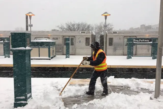 An MTA employee hard at work during this morning's snow.